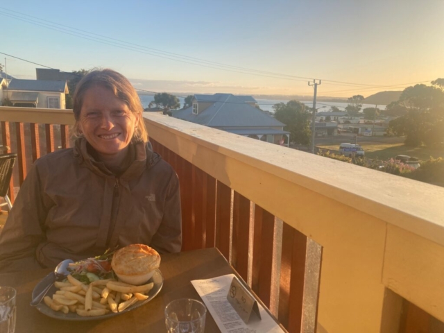 CC enjoys a scallop pie as the sun sets in Stanley