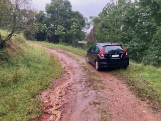 Our city car was no match for the muddy driveway