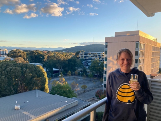 CC enjoys a beer on the balcony