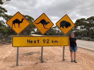 CC next to our first 'exciting' Nullabor sign