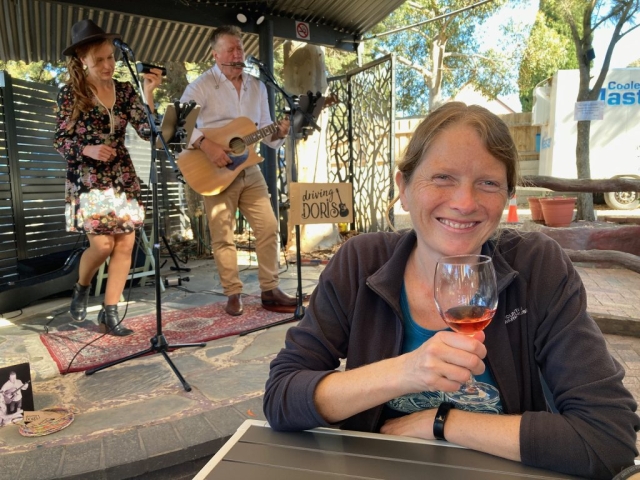 CC enjoys a glass of wine while listening to a local band at Sabella