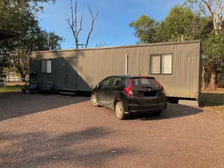 Parked outside our shipping container