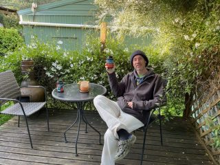PB enjoys a beer on the back deck
