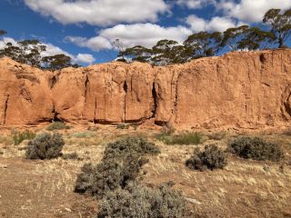 Red cliffs on the banks of the creek